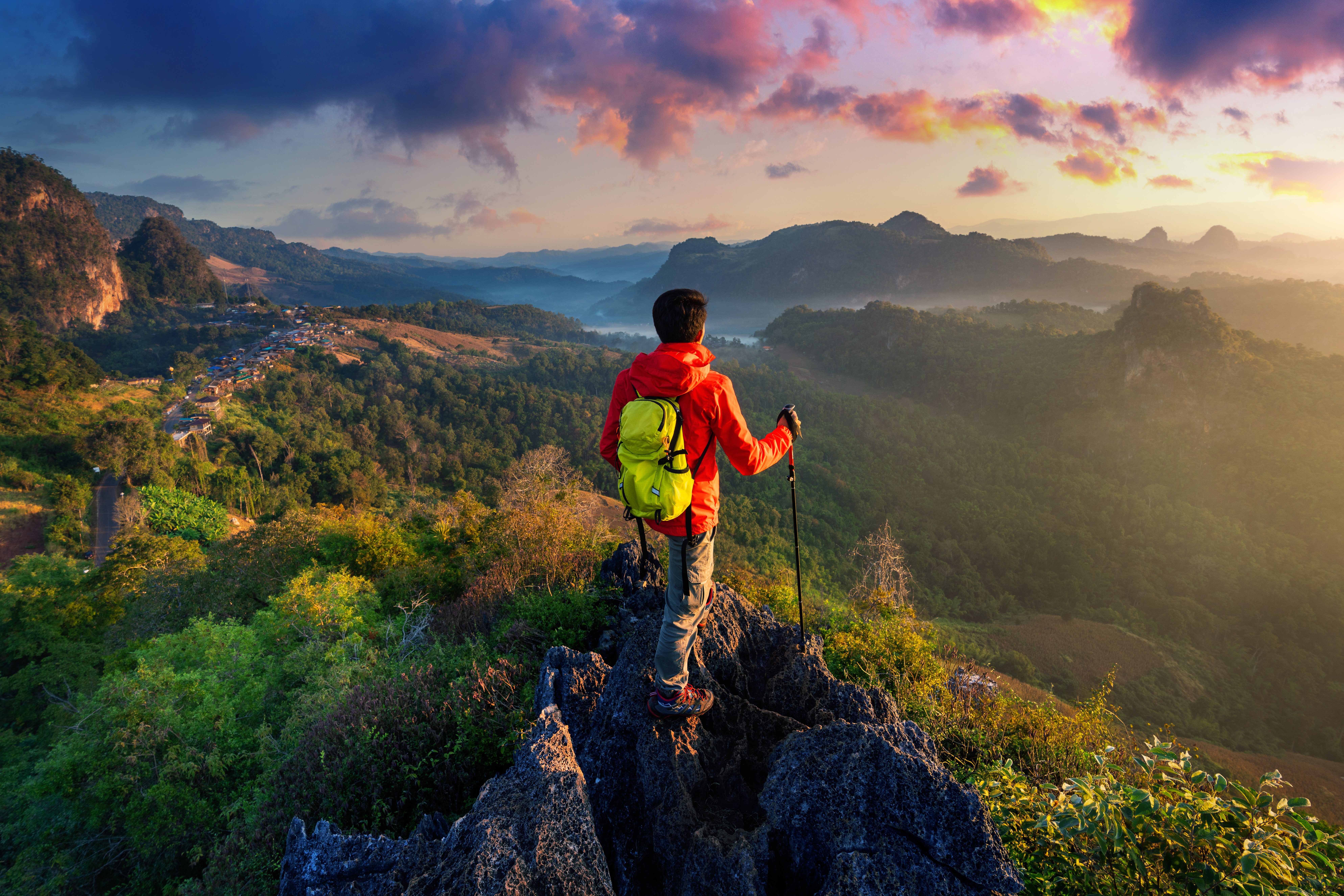 Traveller looking out over a mountain valley